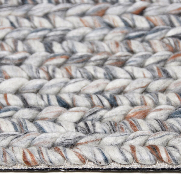 Zijkant detail aanzicht van vloerkleed ETNA, in de kleur naturel roest blauw, gemaakt van wol.