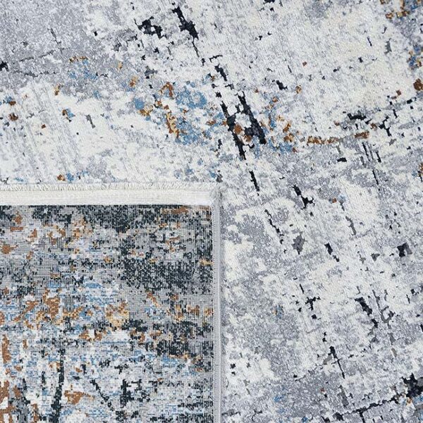 Achterkant hoek aanzicht van vloerkleed OLYMPIA K-1714, in de kleur multi gemaakt van een acryl en viscose mix.