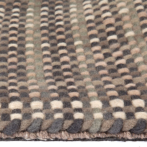 Zijkant detail aanzicht van vloerkleed PARIS, in de kleur beige grijs gemaakt van wol.